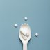 flat lay spoon with pills it scaled